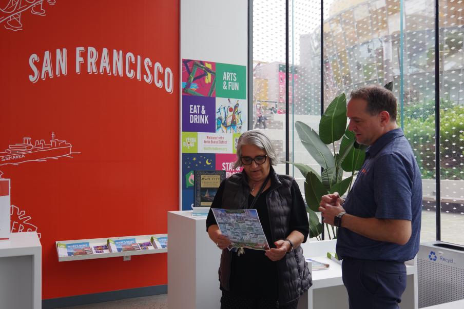 two people inside the visitor information center